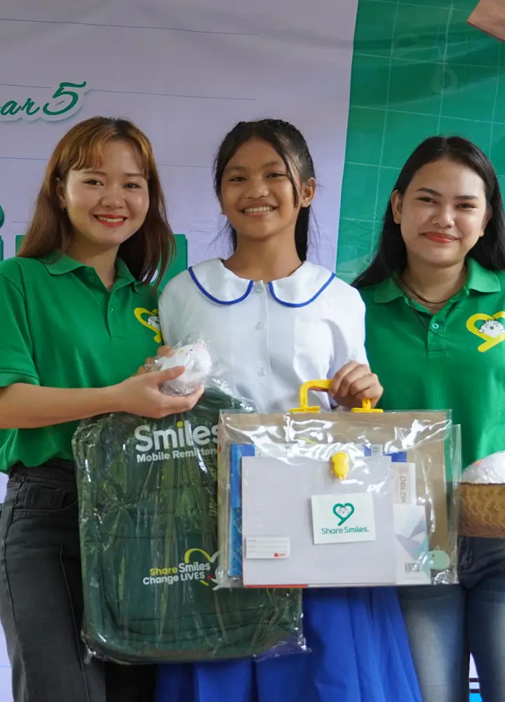 three-school-students-post-with-smiles-one-million-campaign-gift