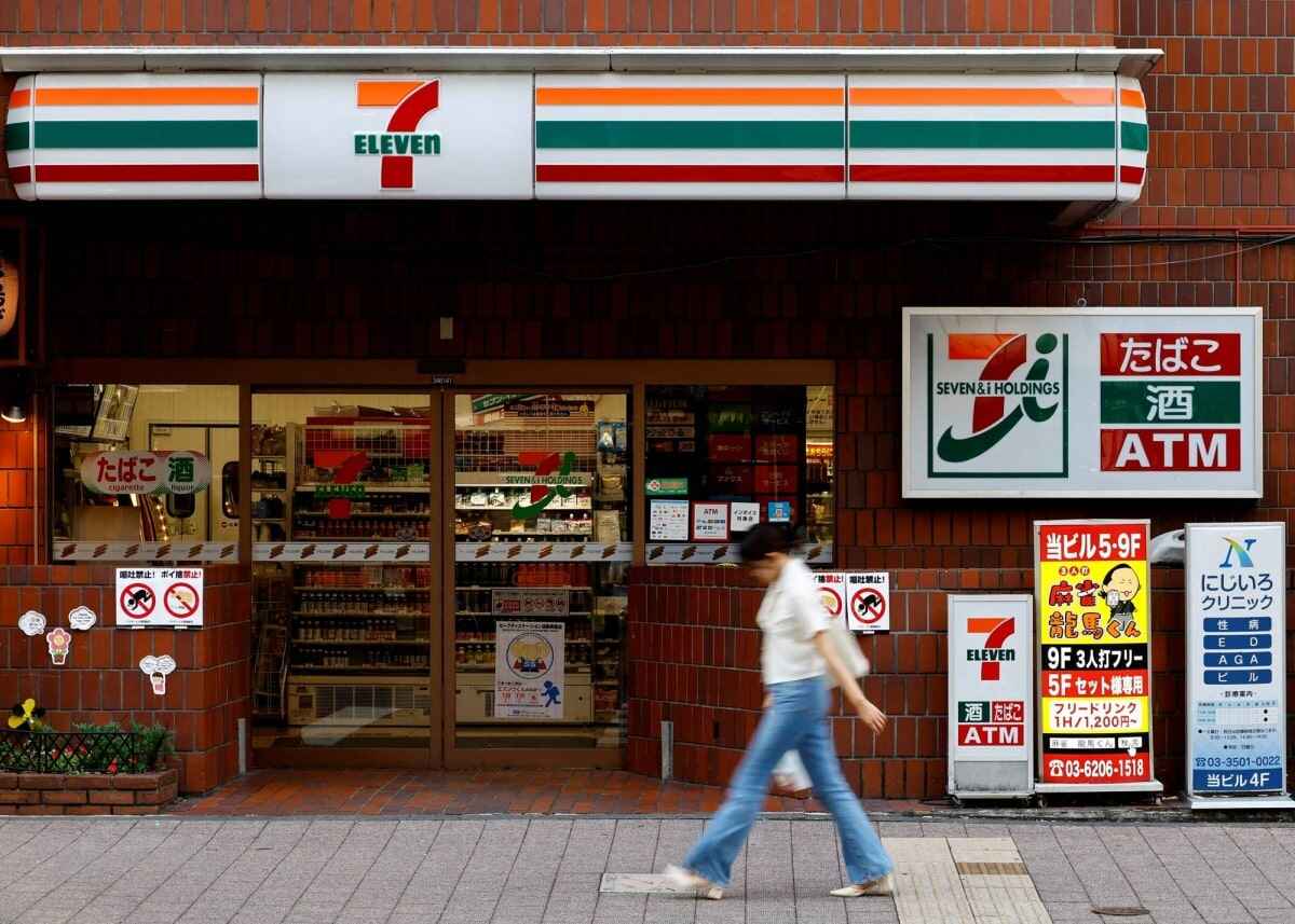 Person walking past 7-Eleven