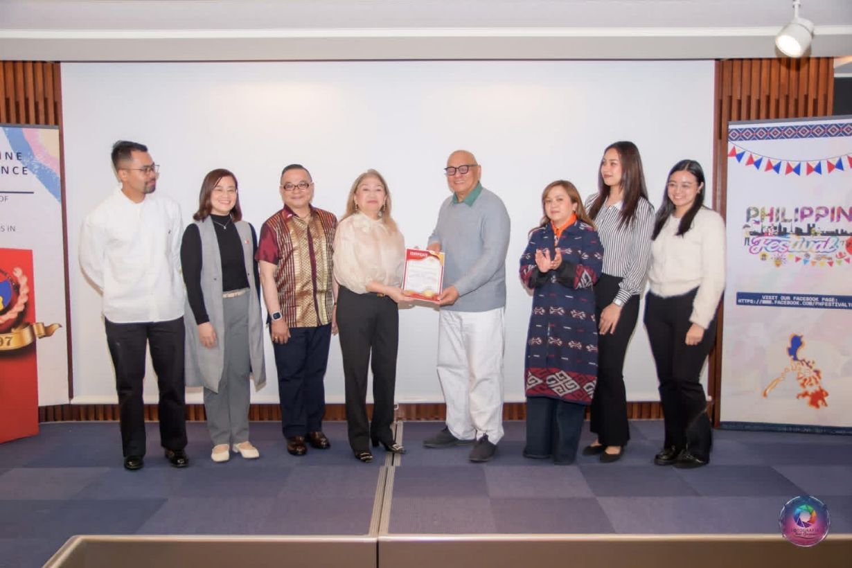 The Smiles team receiving the certificate of appreciation