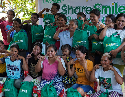 One Million Smiles 2026. A happy group of beneficiary families after receiving their packages