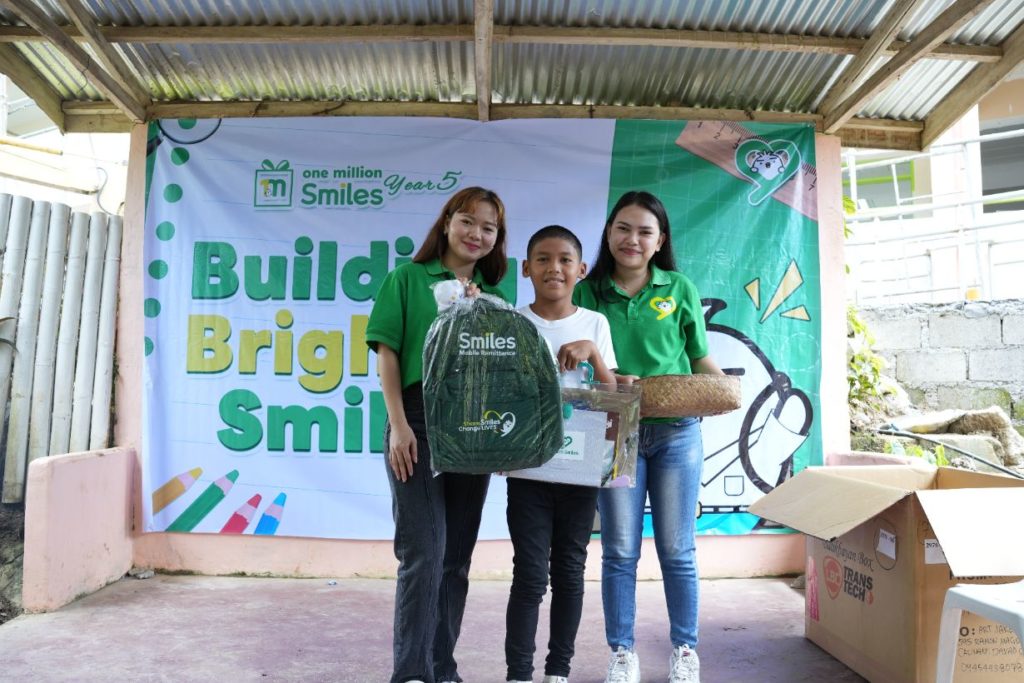 Smiles team with a student beneficiary in Davao