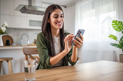 Person sending money from her phones
